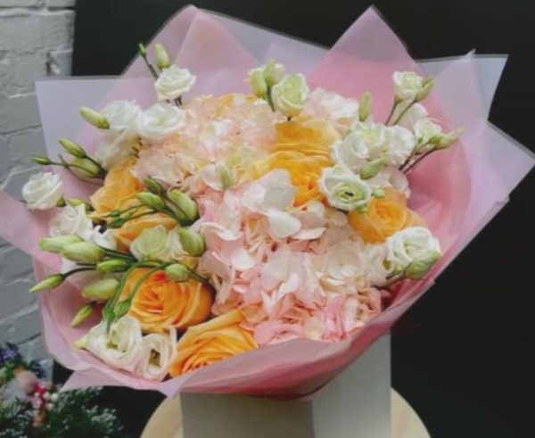 mix bouquet of hydrangeas and roses